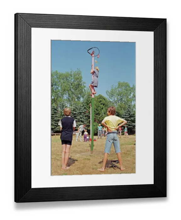 Framed Print : Girl climbing maypole, boys waiting