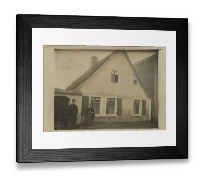 Framed Print : Older couple in front of their family home Framed Print : Older couple in front of their family home