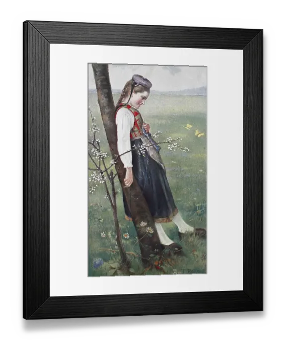 Framed Print : In May, Girl in traditional traditional costume leaning against a tree trunk