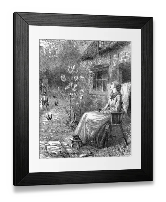Framed Print : Young woman sitting in the garden in summer