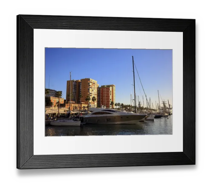 Framed Print : Malaga, houses along the harbour promenade Muelleuno and motorboats