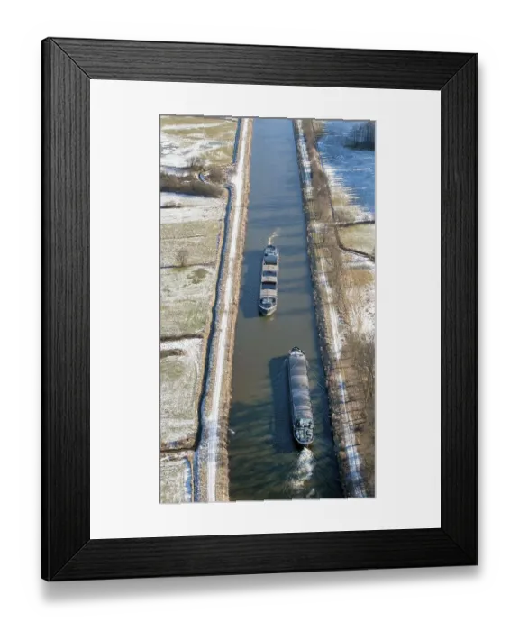 Framed Print : Aerial view of two barges in the Elbe Luebeck Canal in winter Framed Print : Aerial view of two barges in the Elbe Luebeck Canal in winter