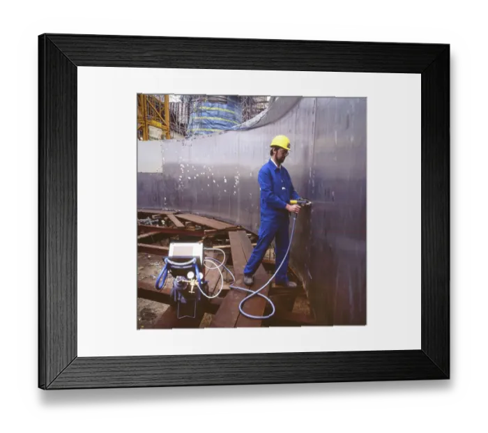 Framed Print : Workmen building a coal-fired power plant