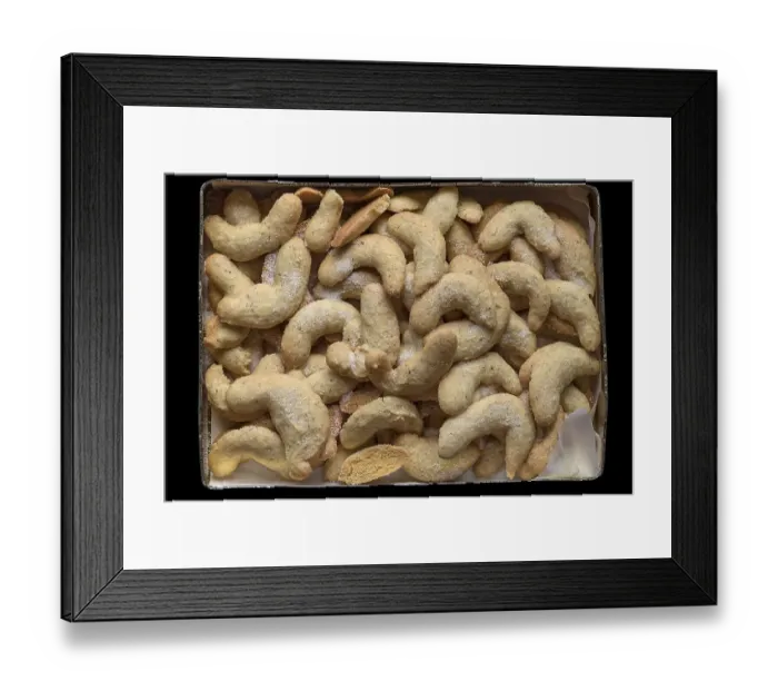 Framed Print : Freshly baked vanilla crescents in a tin