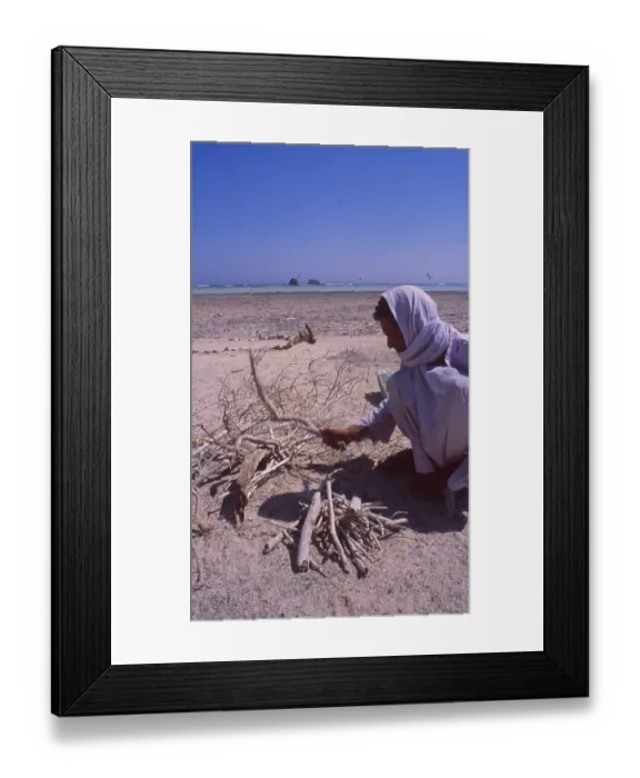 Framed Print : Egypt: Bedouin making a fire on the beach in front of the Maria Schroeder shipwreck in the Sinai desert near Sharm el