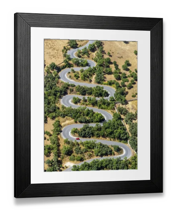 Framed Print : Aerial view of a curved road, car, red