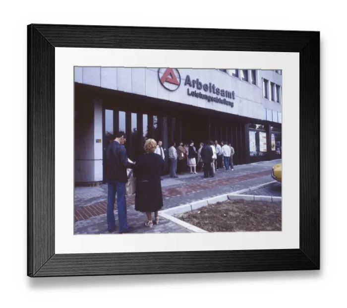 Framed Print : Dortmund. The Dortmund employment office with people waiting in the morning ca