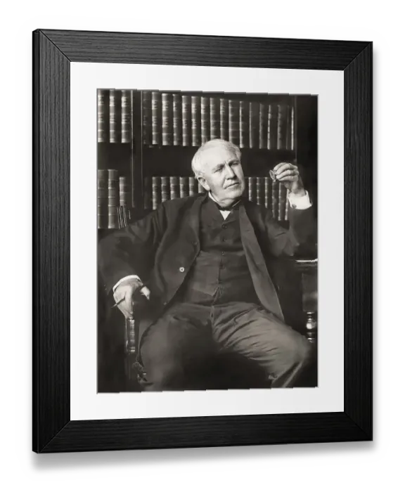 Framed Print : Thomas Alva Edison examining his phonograph recording apparatus