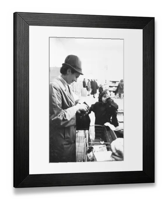 Framed Print : The work of a housewife and mother shopping for groceries at the supermarket and Aldi