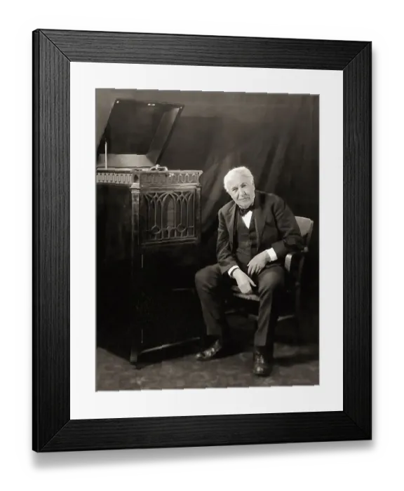 Framed Print : Thomas Alva Edison listening to his disc phonograph
