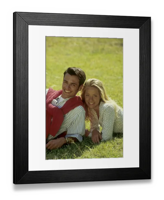 Framed Print : Couple lying on the green meadow Framed Print : Couple lying on the green meadow