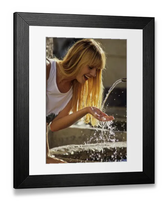 Framed Print : Young woman at the fountain
