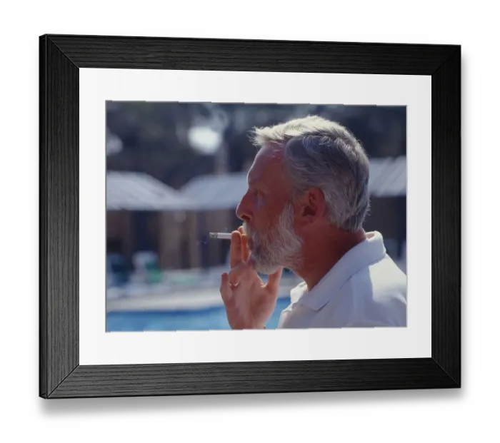 Framed Print : Smoking man, pulls on cigarette