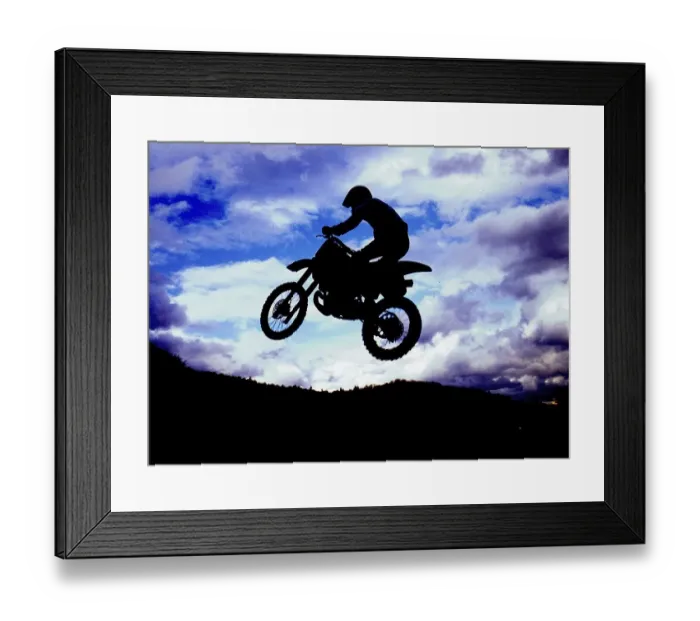 Framed Print : Motocross rider jumping, backlight