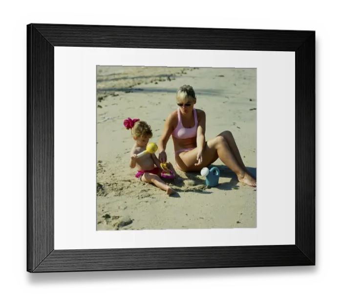 Framed Print : Mother and daughter 2 years on the sandy beach