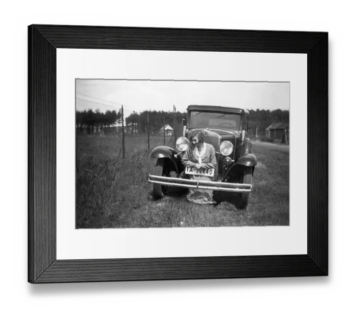 Framed Print : Woman posing in front of a car