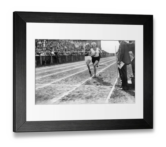 Framed Print : Two female runners at the finish line