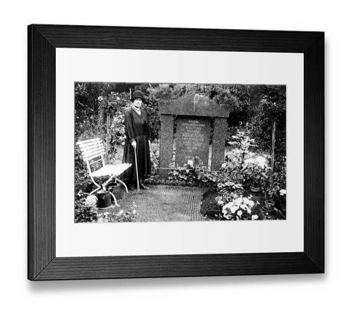 Framed Print : Woman mourning at grave, cemetery