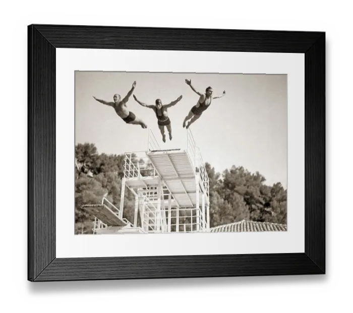 Framed Print : Three men jumping in a swimming pool