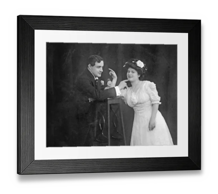 Framed Print : Pair pointing finger at each other, ca
