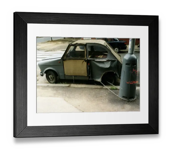 Framed Print : Broken car chained to a lamppost ca