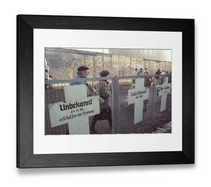 Framed Print : Berlin people passing on the west side of the wall at memorial crosses for victims of the GDR regime Framed Print : Berlin people passing on the west side of the wall at memorial crosses for victims of the GDR regime