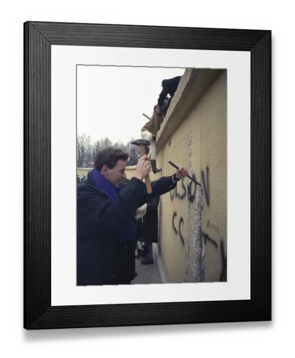 Framed Print : People climbing the Berlin Wall at Brandenburg Gate