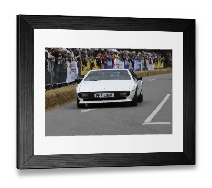 Framed Print : A white sports car drives on a race track Framed Print : A white sports car drives on a race track