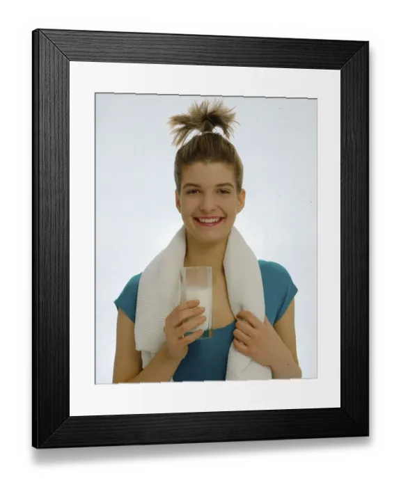 Framed Print : Young woman with milk glass