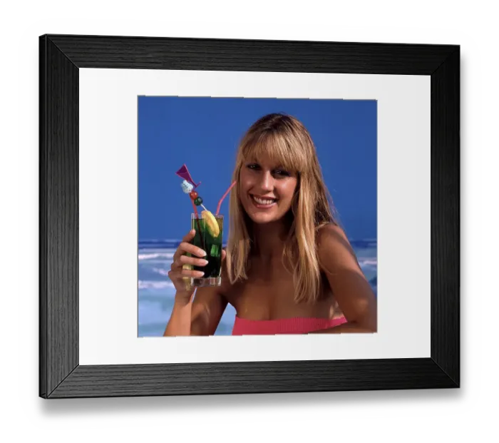 Framed Print : Woman with cocktail by the sea
