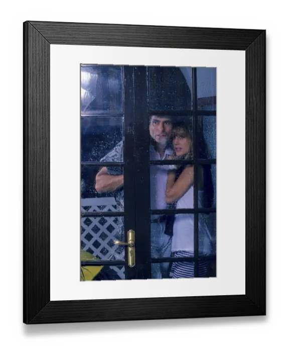 Framed Print : Couple looking out of the window Rainy weather