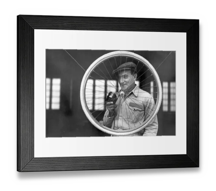 Framed Print : Handicraft, man with bicycle tyre
