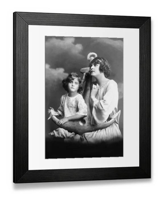 Framed Print : Mother and daughter pose with anchor and hope that the father returns healthy from the sea