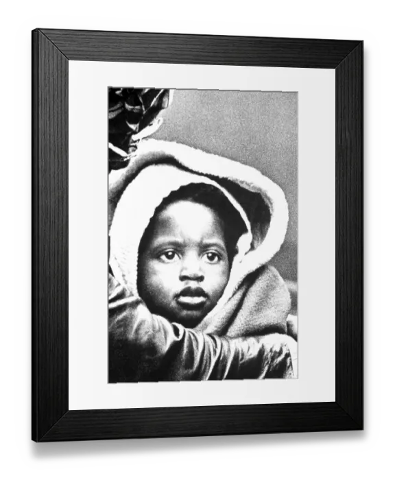 Framed Print : Dark skinned child with sad look