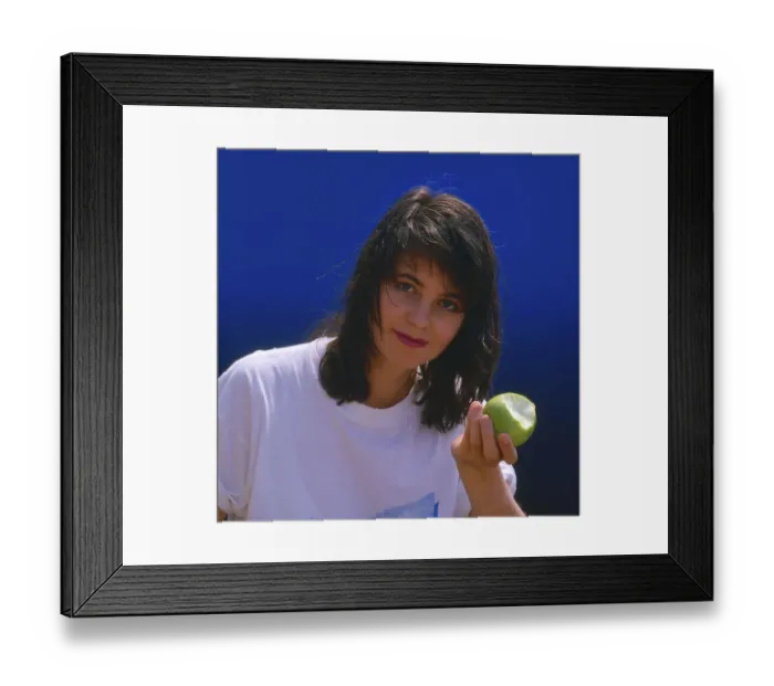 Framed Print : Young woman with apple