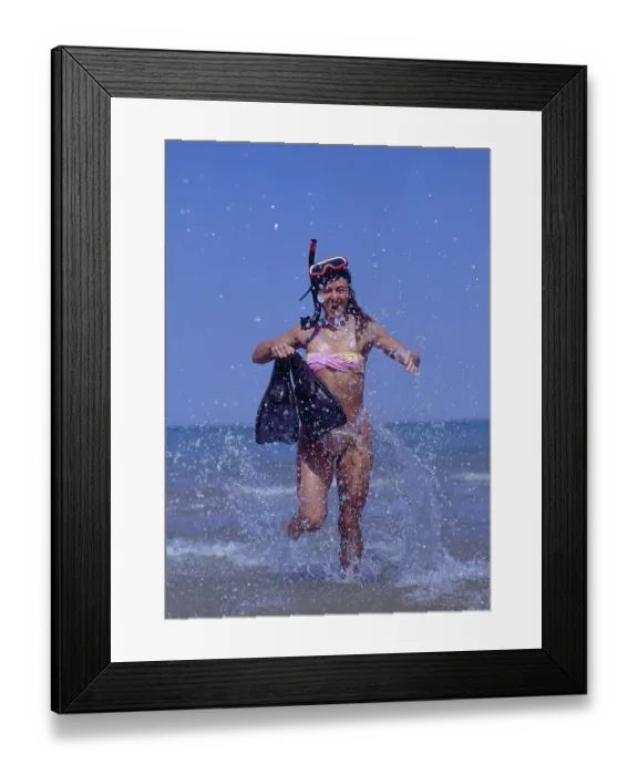 Framed Print : Woman at the sea with fins, diving goggles and snorkel