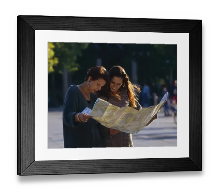 Framed Print : Two young woman with a city map Framed Print : Two young woman with a city map