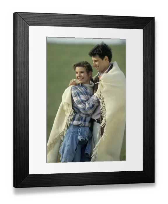 Framed Print : Lovers embrace and cuddle in a blanket Framed Print : Lovers embrace and cuddle in a blanket