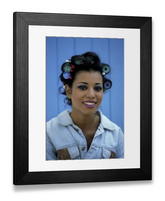 Framed Print : Young woman with curlers in her hair