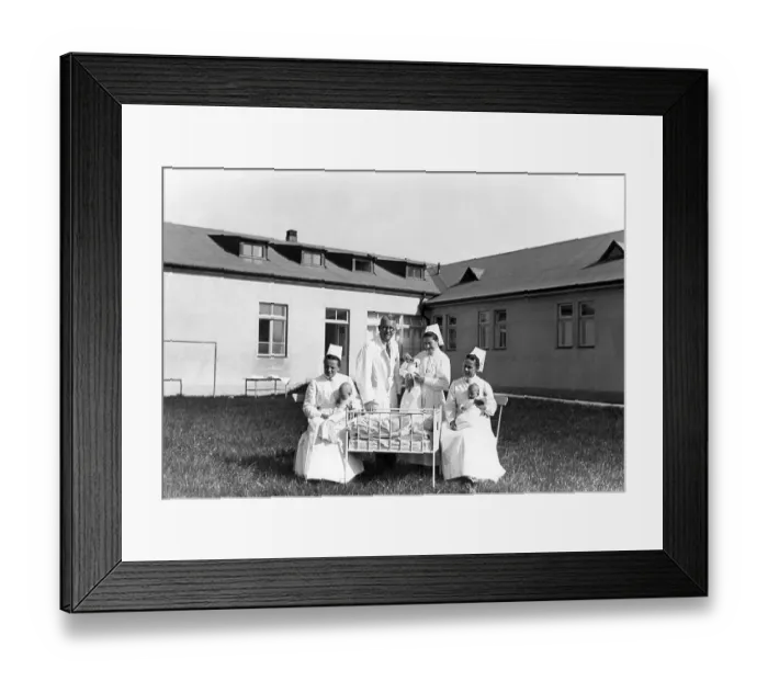 Framed Print : Medicine, health, doctor with three nurses and babies Framed Print : Medicine, health, doctor with three nurses and babies