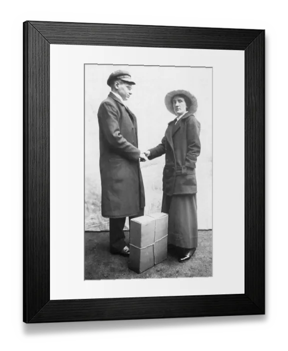 Framed Print : Man hands over a parcel, 1930s, Germany, Europe