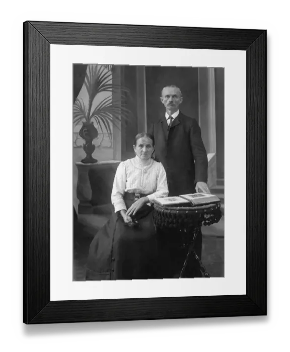 Framed Print : Old married couple posing in front of the camera