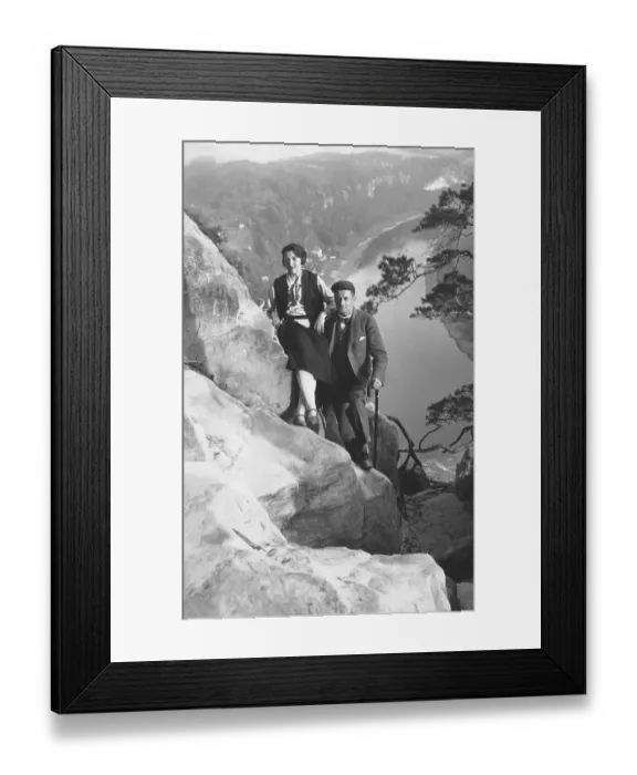 Framed Print : Couple hiking, rocks, ca. 1930s Framed Print : Couple hiking, rocks, ca. 1930s
