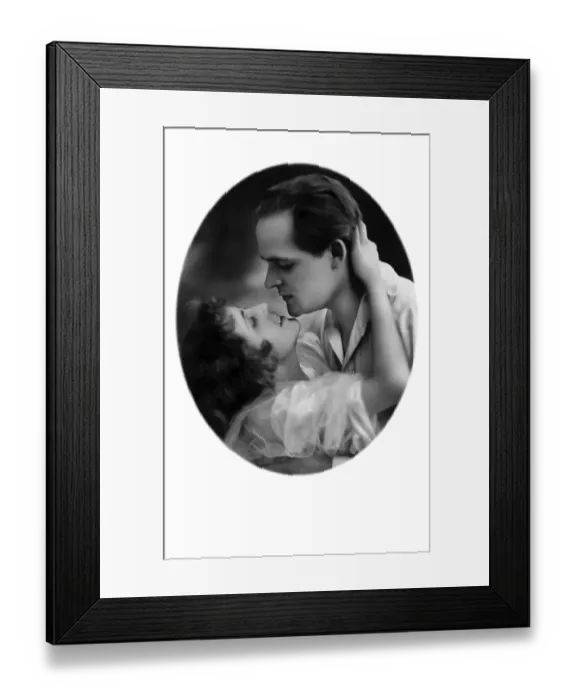 Framed Print : Man and woman kissing in a tender embrace