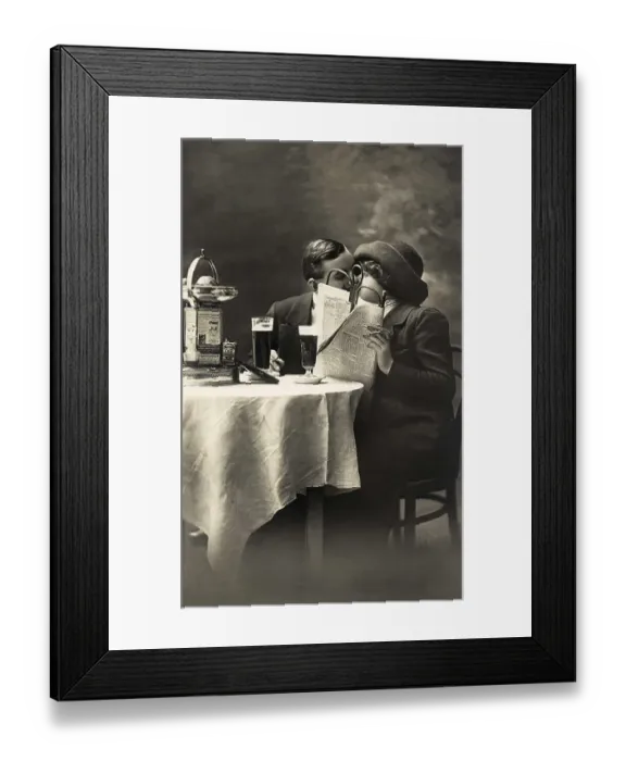 Framed Print : Couple kissing in a pub, newspaper as privacy
