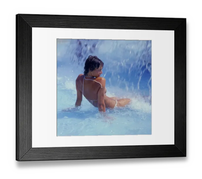 Framed Print : Woman under waterfall swimming pool