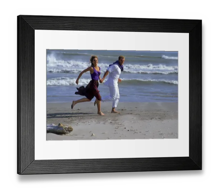 Framed Print : Young couple walking on the beach Framed Print : Young couple walking on the beach