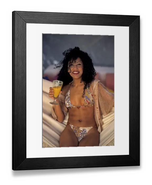 Framed Print : Young woman sitting in the hammock