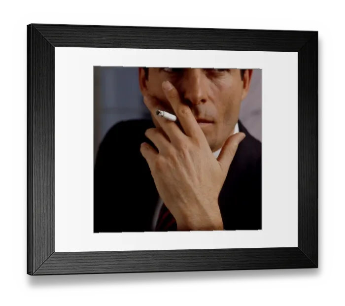 Framed Print : Young man with cigarette in mouth