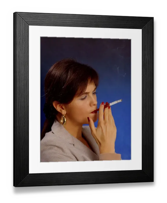 Framed Print : Woman smokes cigarette with snitch mouthpiece Framed Print : Woman smokes cigarette with snitch mouthpiece